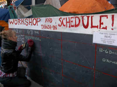 Woman Writing Schedule on Chalkboard - Zucotti Park - Occupy Wall Street