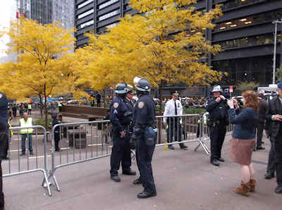 Woman takes pictures and is swarmed by cops - Zucotti Park - Occupy Wall Street